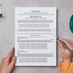 A mid-career resume template on a grey desk. A woman wearing orange is holding a pencil